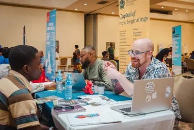 Attendees exploring institution booths at the study abroad fair